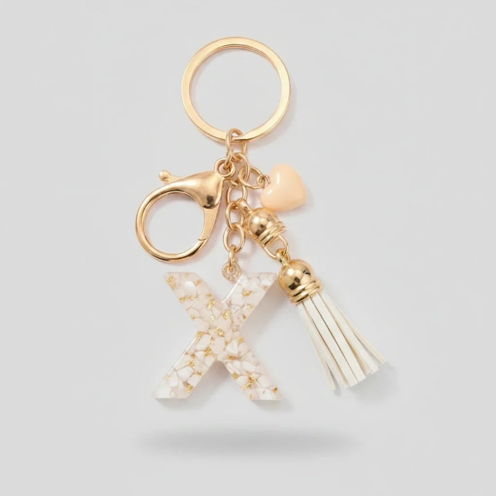 Porte-clés beige avec initiales, lettre X